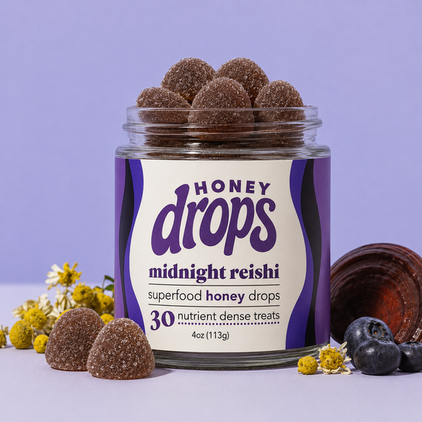Dark purple Midnight Reishi supplement bottle from Eat Honey Drops with a close-up view of the label.