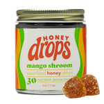 Eat Honey Drops Mango Shroom confection, showcasing colorful mango-flavored mushroom-shaped candies in bright packaging.