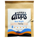 Close-up of Eat Honey Drops Bee Legit package featuring honey bee branding and vibrant yellow packaging design.